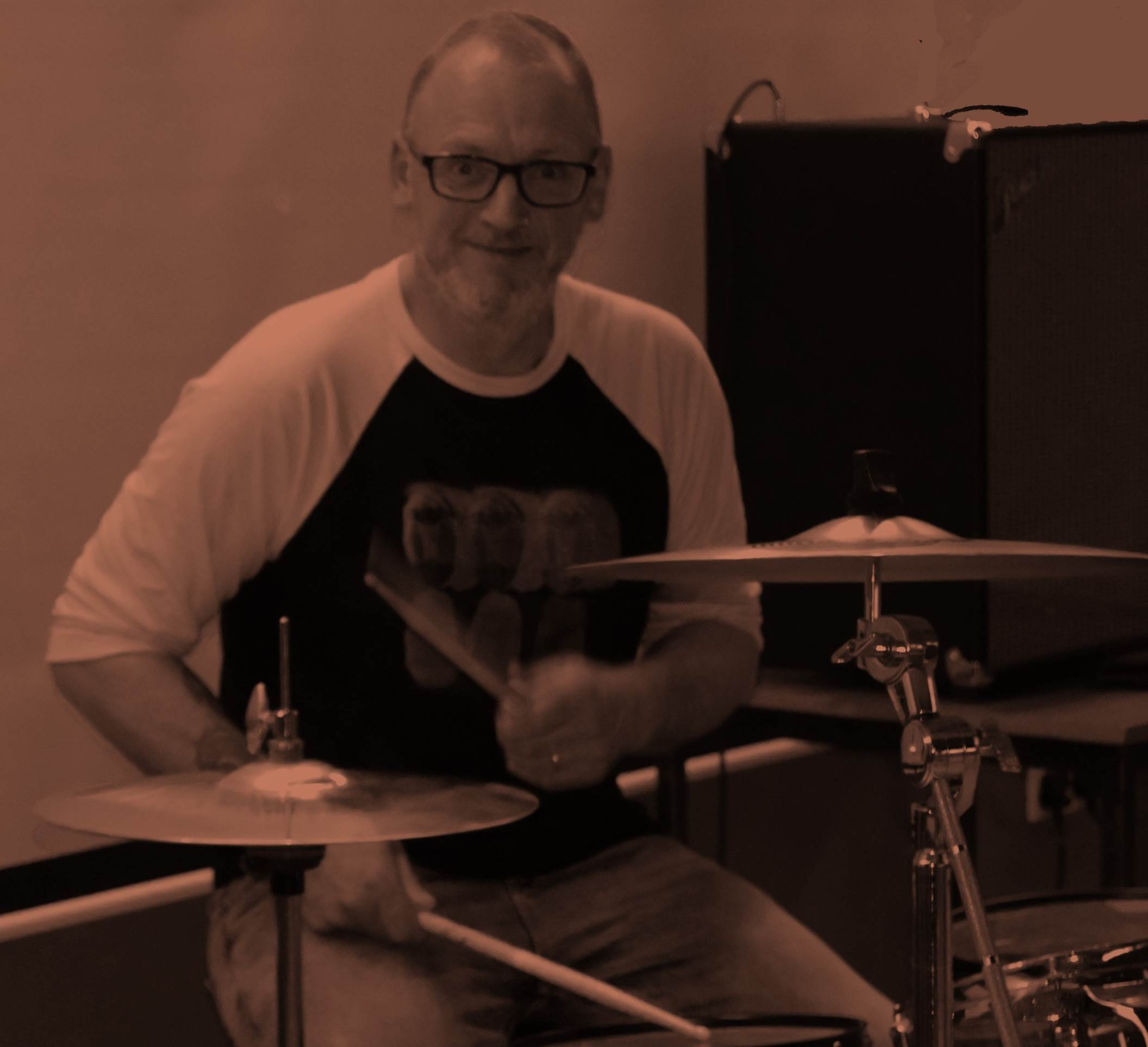 A person playing drums

Description automatically generated with medium confidence